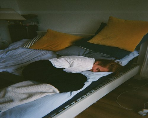 Person sleeping peacefully in a comfortable bed